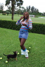 Serena and her pooch play ball